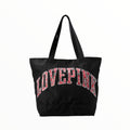 Bolsa TOTE con estampado al frente y cierre, en tela tipo lona